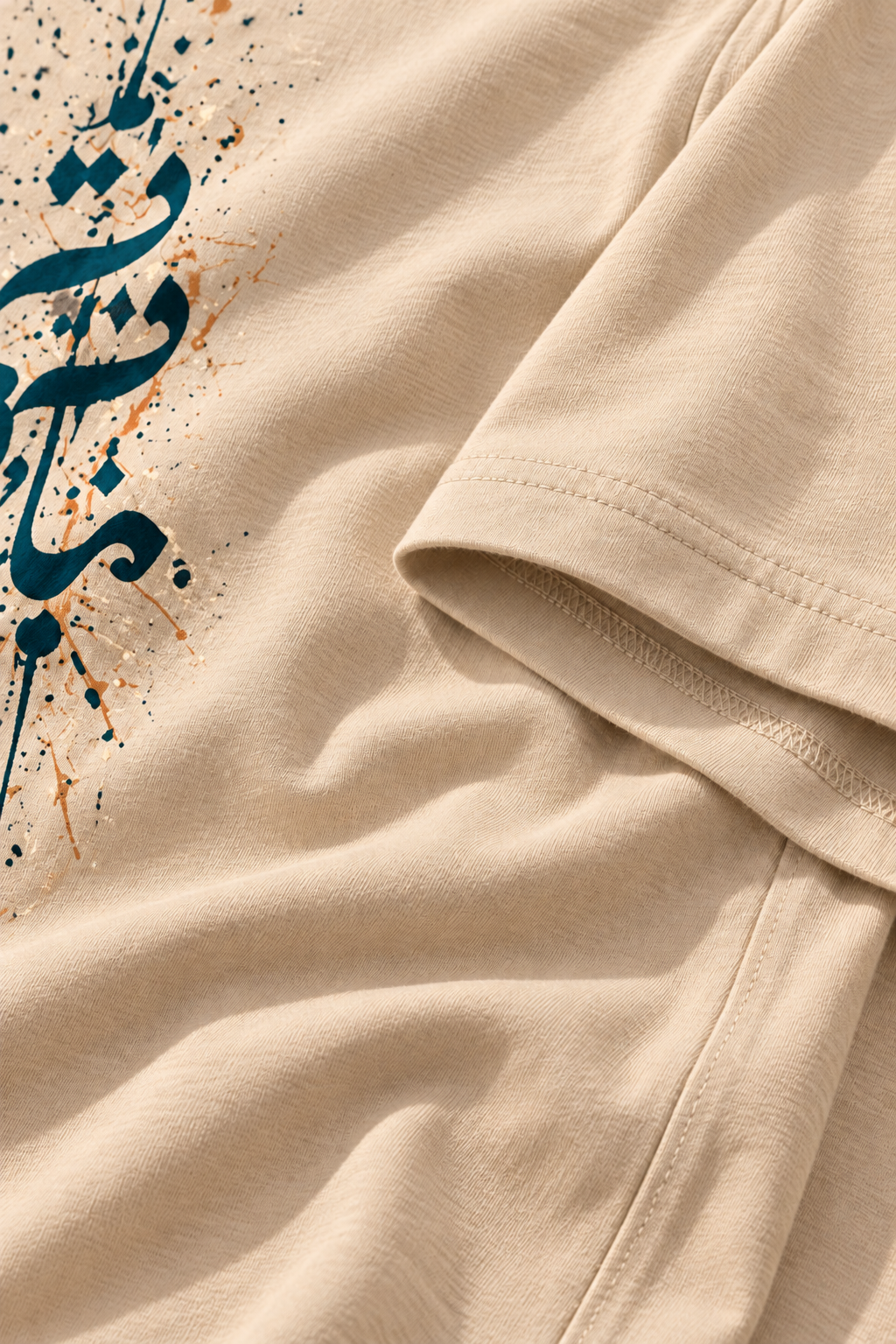 Cotton fabric detail of the 7EVII Urdu calligraphy T-shirt in Beige