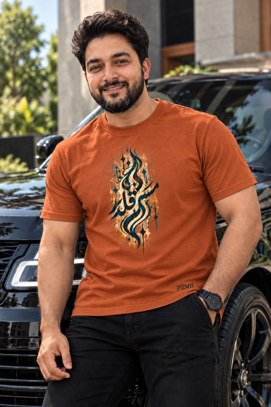 Irf wearing the 7EVII Urdu calligraphy T-shirt in Rust, front view