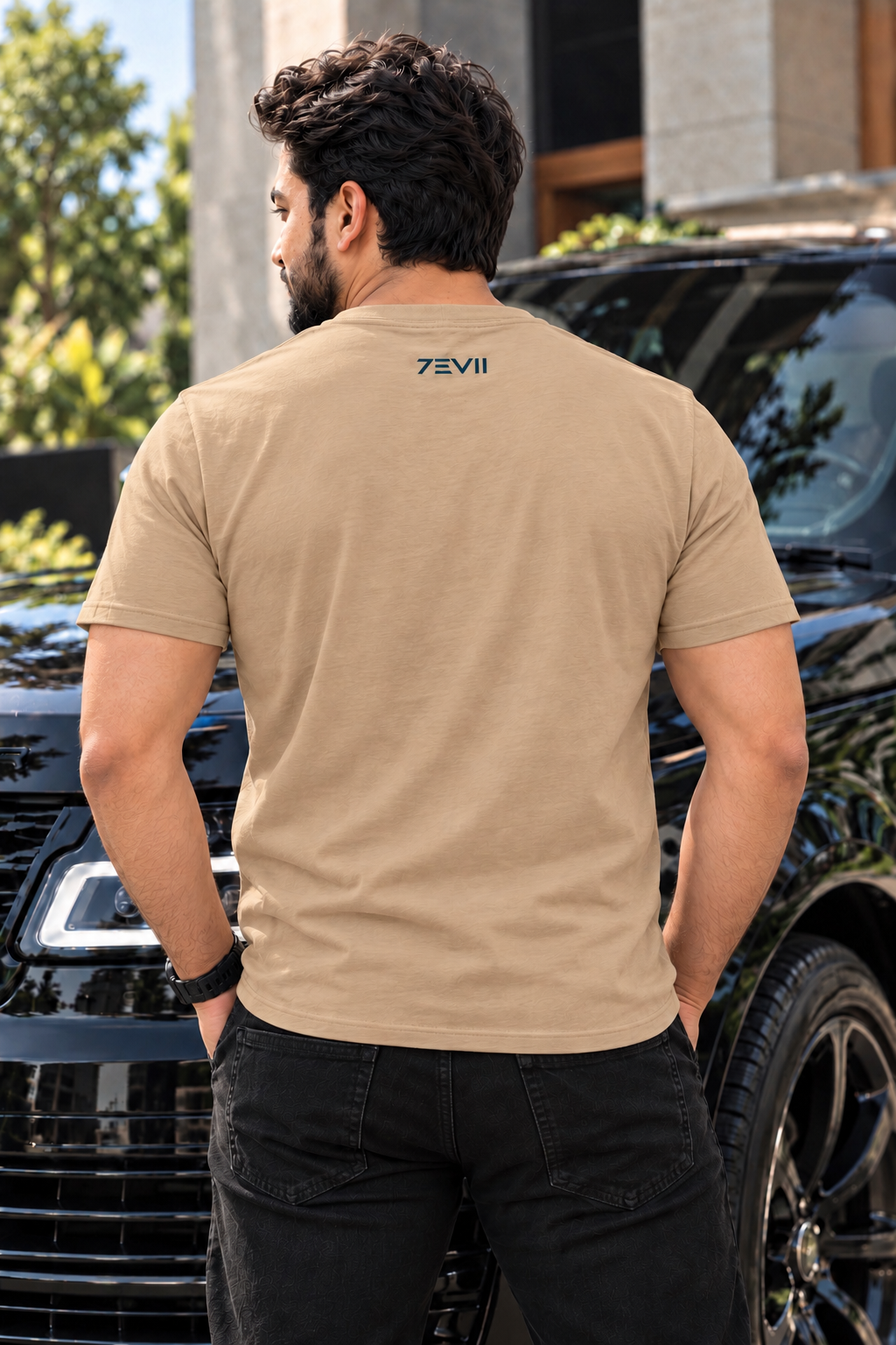 Irf wearing 7EVII calligraphy T-shirt in Sand, back view